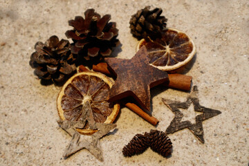 Christmas decoration with typical symbols on sand