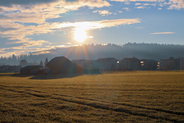 Landscape with a Village with sundown and clouds in Wangen an der Aare, Switzerland