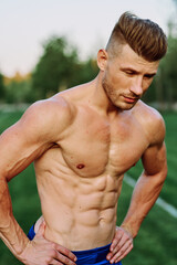 man with pumped up muscular body outdoors health workout