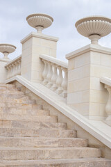 White staircase with columns leading up. Architecture and construction