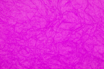 Pink violet crumpled paper decorative background texture