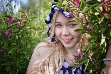 young woman portrait in flowers polka dot dress