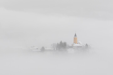 Winter in Croatia. Church. Fog. Snow