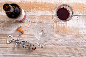 A bottle of alcohol and glasses.