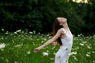 Obraz premium pretty woman in white dress field flowers freedom nature
