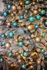 Christmas decorations on the tree, beautiful toys in light colors. Christmas atmosphere, new year