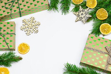 Christmas background with gift boxes, fir tree branches. Flat lay. Christmas and New Year concept. 