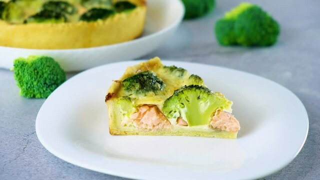 Egg-based frittata, omelette with salmon, broccoli and cheese in crust. Mediterranean paleo or ketogenic healthy diet. Delicisouc dish for restaurant or cafe menu.