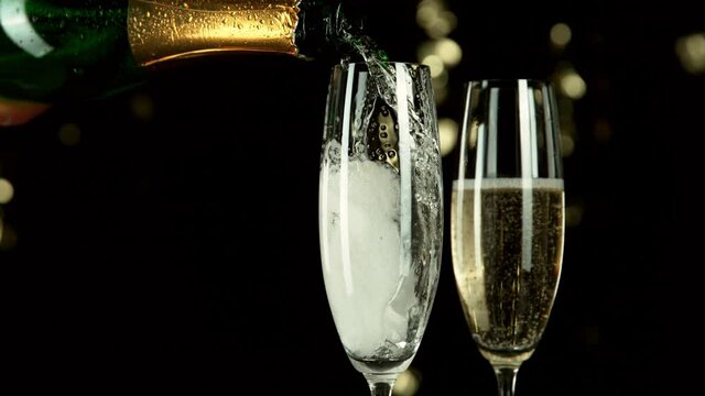 Super slow motion of pouring champagne wine with camera motion. Speed ramp effect. Filmed on high speed cinema camera, 1000fps.