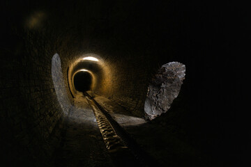 Old brickwork sewer tunnel. Underground river or old rainwater collector of the 19th century.