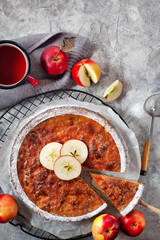Homemade delicious apple pie, top view, gray background