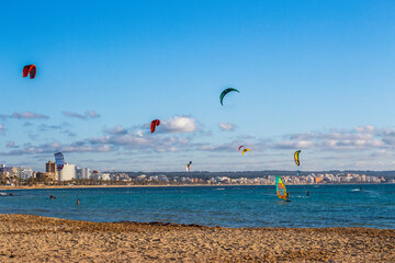 Kite surfers in Can Pastilla, Majorca. Mediterranean sea.