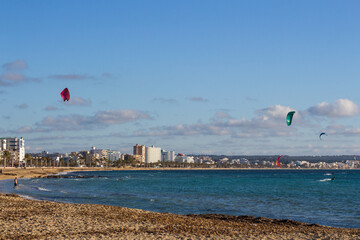 Kite surfers in Can Pastilla, Majorca. Mediterranean sea.