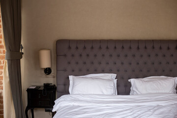 Loft bedroom interior with big bed