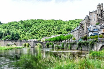 Fototapeta na wymiar Estaing on the River Lot is counted as Les Plus Beaux Villages de France. The Gothic bridge from the early sixteenth century and the Chateau d'Estaing are the first to stand out. 