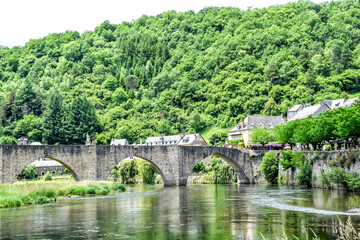 Fototapeta na wymiar The Gothic bridge of Estaing is listed as a UNESCO World Heritage Site as part of the Peligrims Route to Santiago de Compostela. Many pilgrims still walk across the bridge every year.