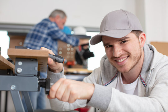 portrait of youg man during carpentry training course