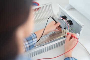 a technician soldering metal components