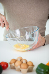 woman whisking eggs for christmas cookies