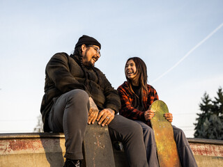 Indigenous father and non-binary skater and outdoors