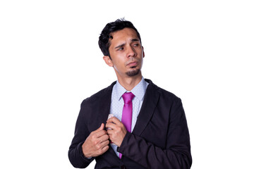 Businessman secretly taking money. Young adult young man dressed in elegant clothes keeps money in his sack with suspicious look, isolated on all-white background.