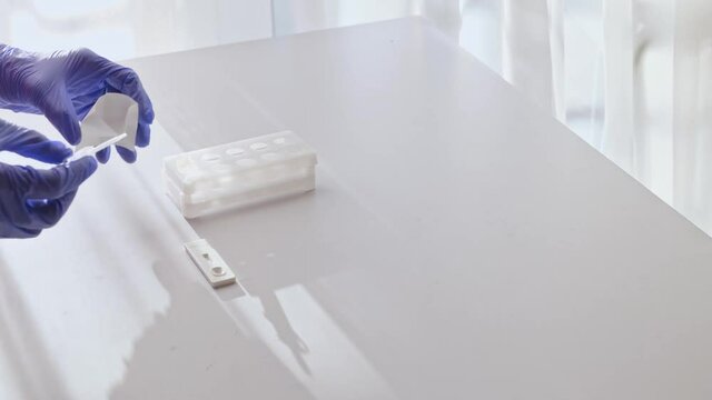 covid-19 antigen pcr express test, placing saliva 