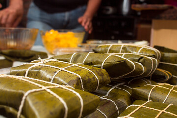 Traditional Venezuelan cuisine for the December festivities, Hallacas are a typical dish that is prepared as a family and represents ancestral traditions of a mixture of ingredients wrapped in leaves