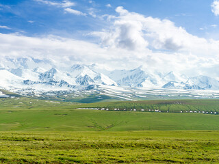 Fototapeta premium The peaks of Pik Kurumdy (6614 m) at the border triangle of Kyrgyzstan, China and Tajikistan. The Alaj valley in the Pamir Mountains. Central Asia, Kyrgyzstan