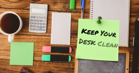 Animation of keep your desk clean text on memo note over office items on tidy desk