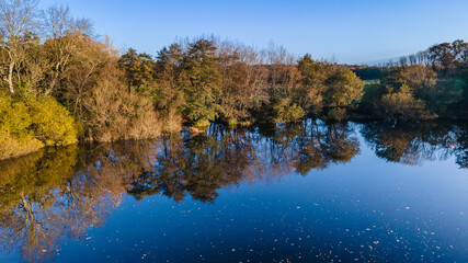 Atumn colours by the lake near Steyning, West Sussex, UK.