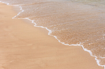 wave and sand on the beach
