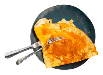 Just cooked crepe with salted butter caramel served on plate. Isolated over white background
