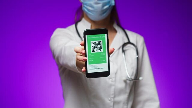 Woman Doctor In Medical Uniform Showing Vaccination Passport With Qr Code On Phone, International Coronavirus Vaccine Certificate On Mobile Device, Digital Covid 19 Passport, Green Zone.