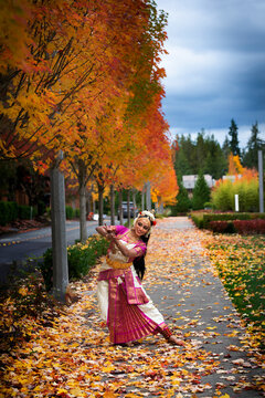 Bharatanatyam dancer outdoor in fall 
