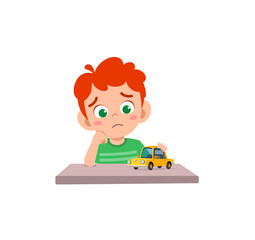 cute boy play toy car alone and feel sad