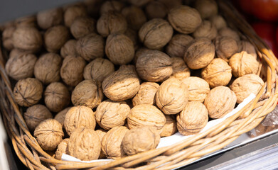 Whole walnuts with brown nutshells on retail market