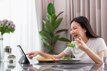 salad concept the lady having Caesar salad and slices of toasted bread while having a video call...