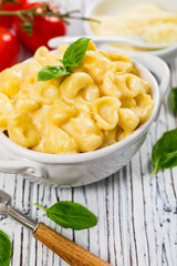 Parmesan Mac and Cheese on White Wooden Background. Selective focus.