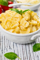 Parmesan Mac and Cheese on White Wooden Background. Selective focus.