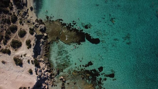 Aerial drone view of the rocky coast and the Mediterranean Sea near the scenic Aphrodite Trail in the Akamas Peninsula National Park, Cyprus. Famous tourist travel destination near Polis city, Cyprus