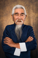 chinese old man with white hair and beard in tradional chinese clothing