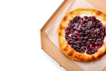 Cardboard box with tasty cherry khachapuri on white background