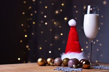 Christmas, cookie and milk for santa claus, in front of the christmas lights