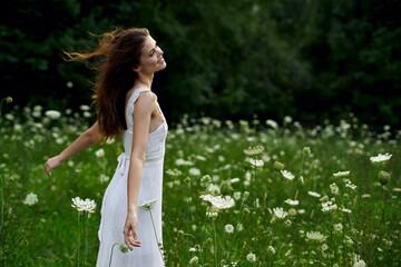 pretty woman in white dress field flowers freedom nature