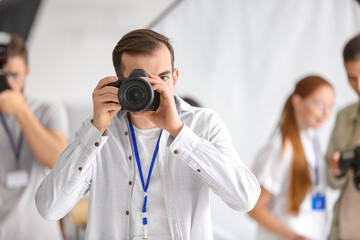 Male photographer during classes in studio