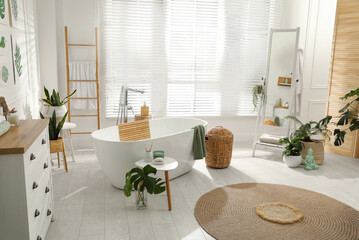 Stylish bathroom interior with green plants. Home design