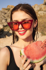 woman eating watermelon outdoors Sun summer close-up