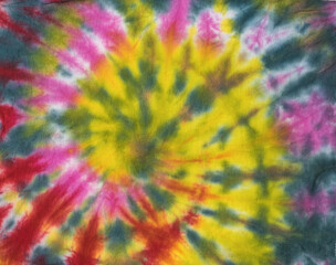 Fabric background with a beautiful tie dye pattern. Flat lay.