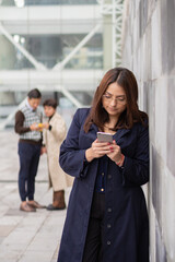 Young woman with her coworkers in the foreground.