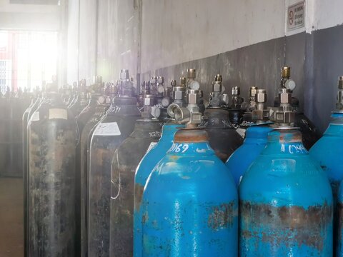 Group of oxygen cylinder tank with compressed gas for industrial use in the factory.